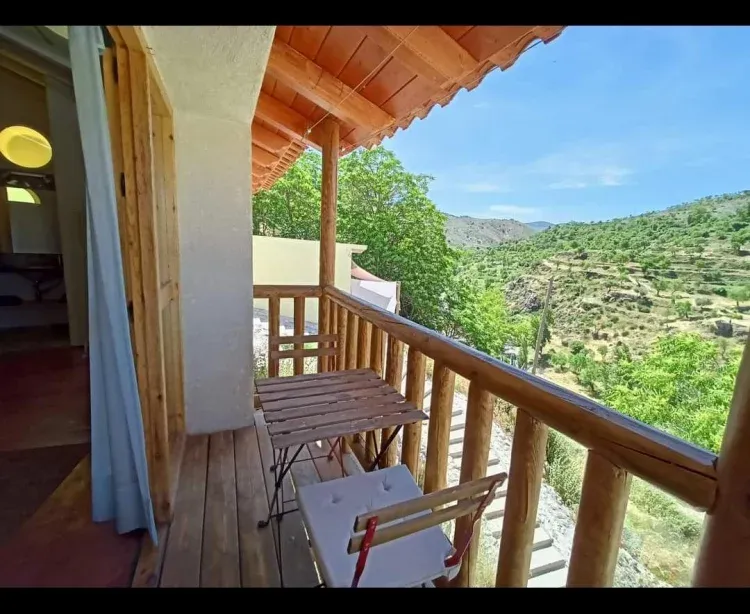 Imagen de Aqui, en el balcón, contemplando el cerro y el pueblo desde la altura... la magia del instante que todos somos reinas y reyes. Vistas sobre el valle, el rio, el pueblo y las montañas del precioso Parque Natural de la sierra de Baza. Lugar mágico!