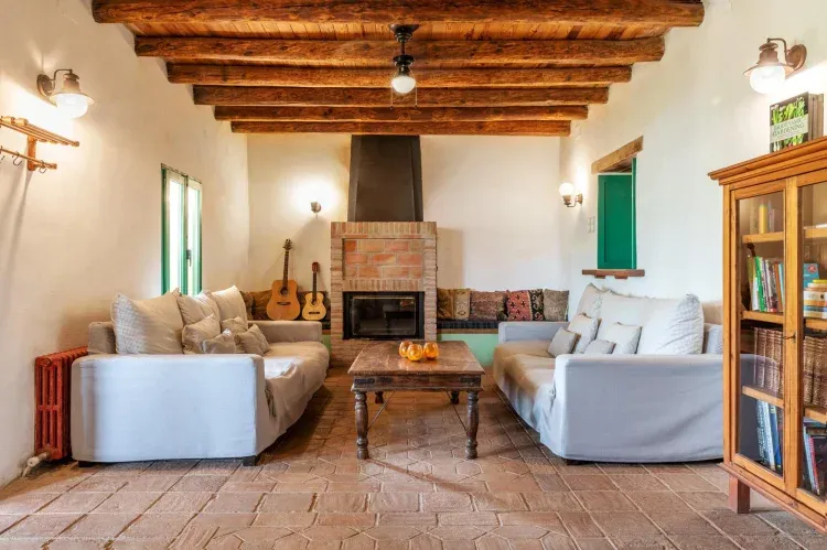 Imagen de Our Living Room is a special place to come together to read, rest, and sit by the fire.