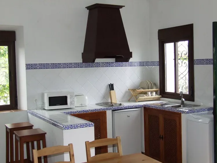 Imagen de cocina abierta al salón en casa 1